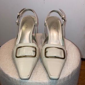 Beige leather heels with vintage Gucci vibe.